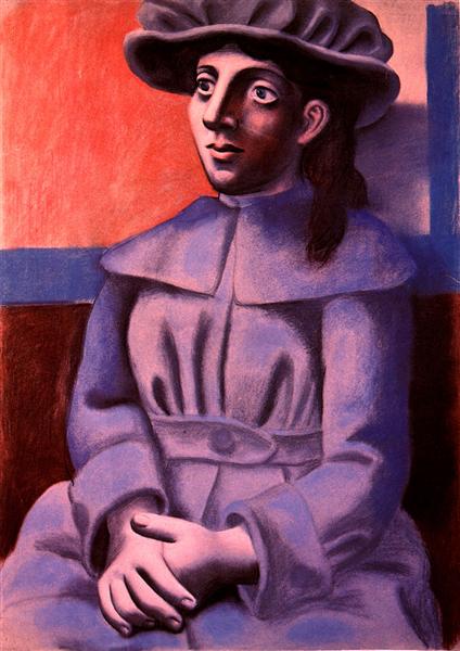 Girl in a hat with her arms crossed