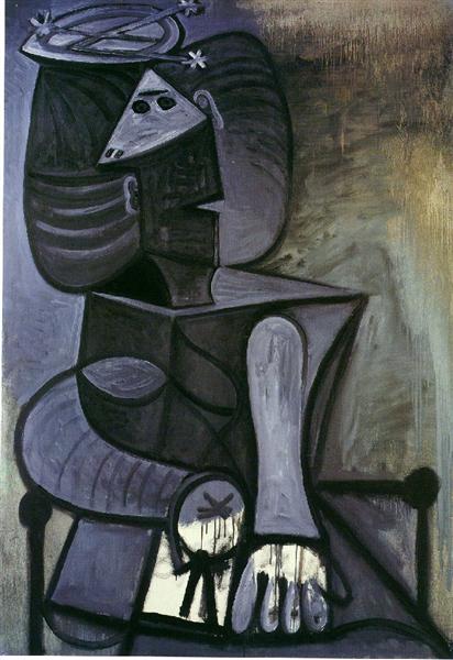 Seated woman with flat hat