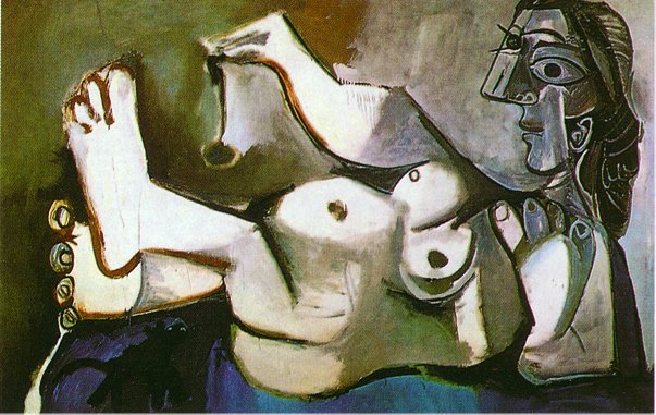 Lying female nude playing with cat