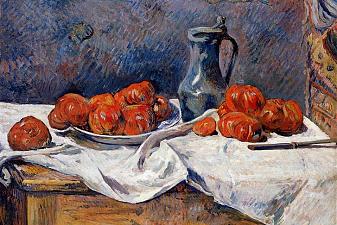 Tomatoes and a pewter tankard on a table