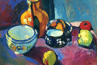 Dishes and Fruit on a Red and Black Carpet