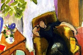 Young Girl in Black in Yellow Armchair