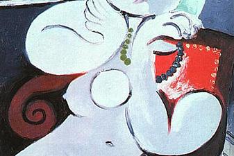 Female nude sitting in red armchair