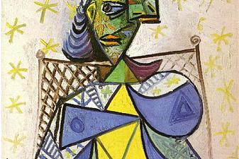 Seated woman with blue and red hat