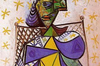 Woman sitting in an armchair