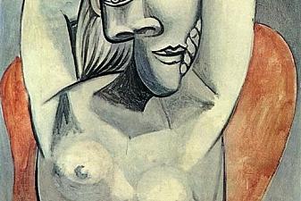 Woman sitting in red armchair