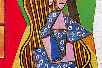 Woman in striped armchair