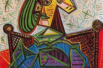 Woman sitting in an armchair