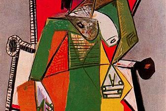 Woman sitting in an armchair