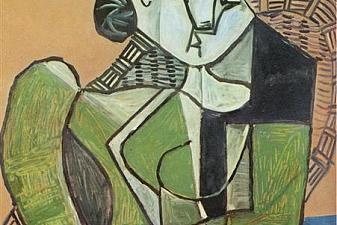 Woman sitting in an armchair