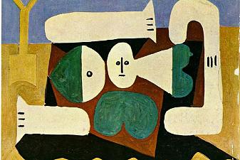 Naked woman on the beach and shovel