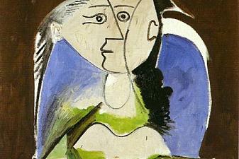 Woman sitting in blue armchair