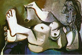 Lying female nude playing  with cat