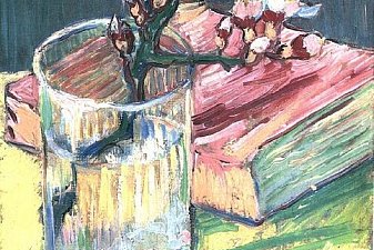 Blossoming Almond Branch in a Glass with a Book